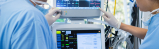 Hospital Staff use a heart monitoring machine