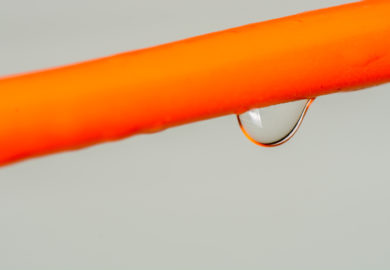 Picture of Water droplet on a orange cable