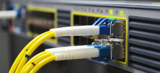Yellow Fiber Optic Cables Plugged In